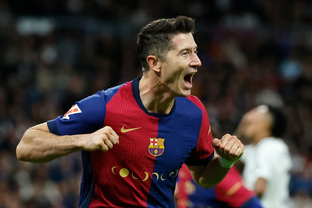 Barcelona’s Robert Lewandowski has netted 23 goals in 21 games across all competitions this season, taking Barcelona top of the Spanish league and up to third in the European standings. — AFP pic