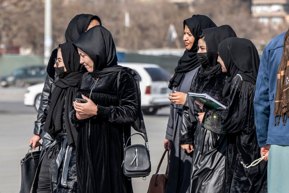 Afghan female students studying health studies walk along a street in Kabul on December 3, 2024. Despair gripped Afghan women healthcare students after the Taliban government ordered, according to multiple sources, the exclusion of Afghan women from medical training, sparking panic across institutions. Since their return to power in 2021, the Taliban government has imposed reams of restrictions on women, making Afghanistan the only country in the world to ban girls from education after primary school. — AFP 