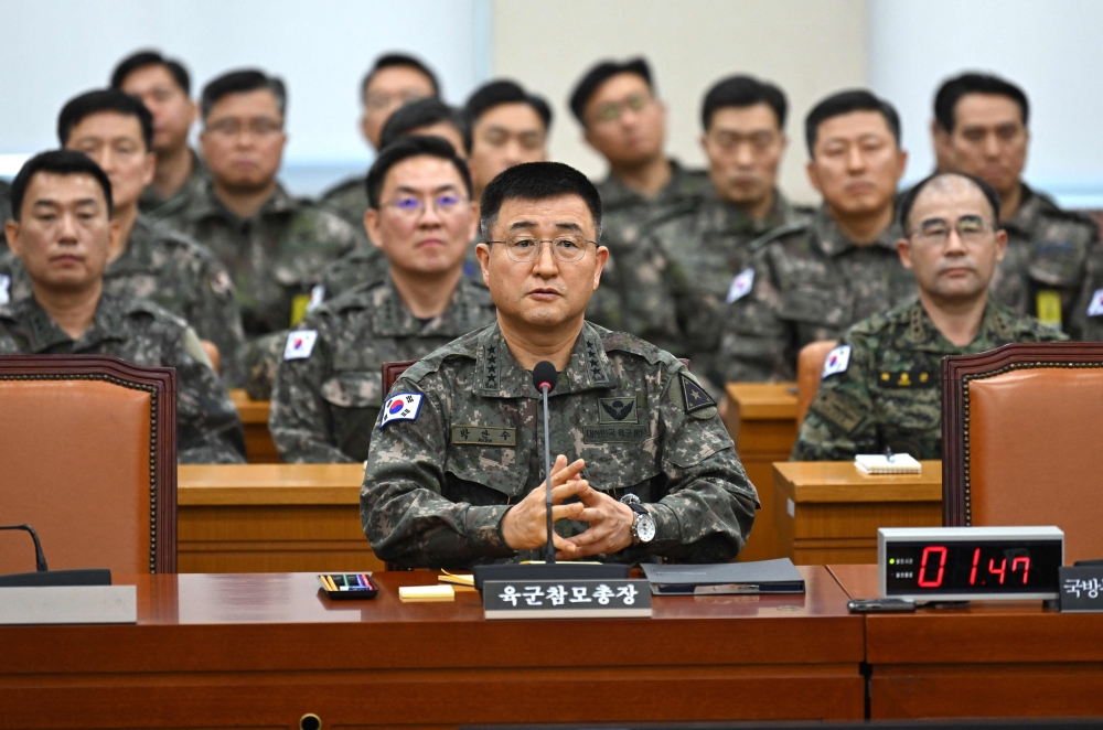 South Korea Army chief General Park An-su (centre) answers lawmakers’ questions during an emergency session of the parliamentary defence committee, where a question-and-answer session was held relating to President Yoon Suk Yeol’s declaration and lifting of martial law, at the National Assembly in Seoul on December 10, 2024. — AFP pic 