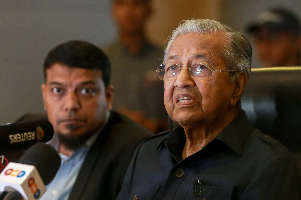 Former prime minister Tun Dr Mahathir Mohamad (right) speaks during a press conference at the Perdana Leadership Foundation in Putrajaya, on Dec 10, 2024. — Picture by Sayuti Zanudin