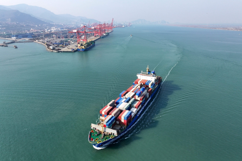 A container ship sails from the port at Lianyungang, in China’s eastern Jiangsu province on December 10, 2024. Chinese President Xi Jinping warned on December 10 that there would be “no winners” in a trade war with the United States and vowed the country would hit its growth goals for the year. — AFP pic