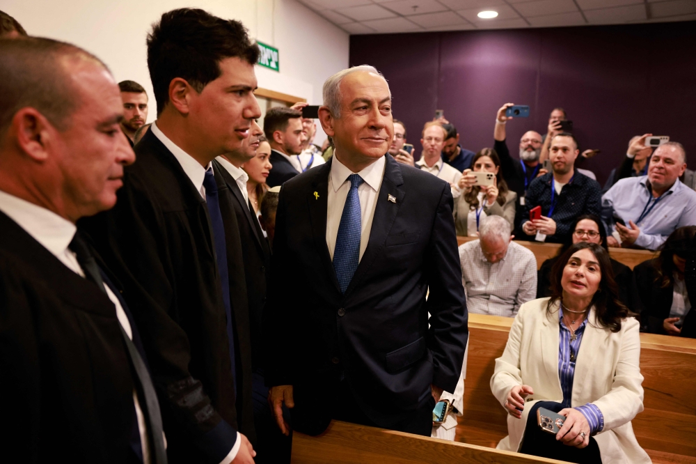 Israeli PM Netanyahu arrives at Tel Aviv court for first testimony in corruption trial. — AFP pic