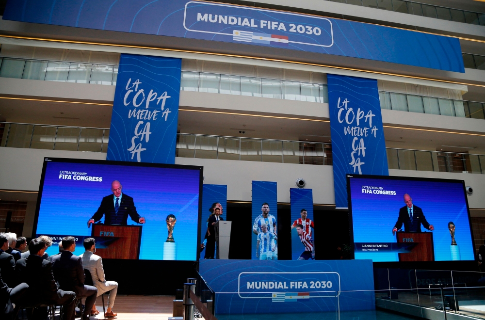Fifa president Gianni Infantino made a remote presentation during the announcement as Conmebol ratifies the hosting of the 2030 World Cup opening matches in South America in Asuncion, Paraguay December 11, 2024. — Reuters pic  
