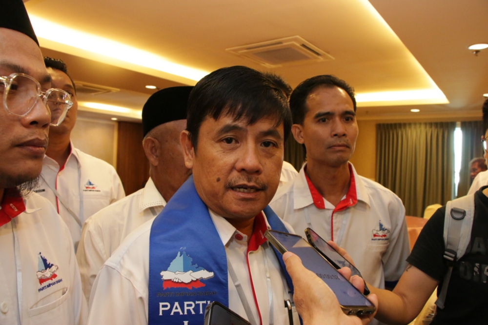 Parti Impian Sabah president Micel Alok speaks to reporters after its first AGM in Kota Kinabalu on December 12, 2024.
