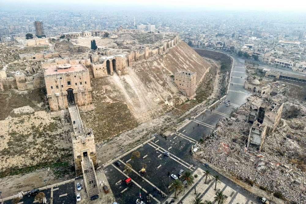 This aerial view shows the Citadel of Aleppo overlooking the northern Syrian city on December 11, 2024. Islamist-led rebels took the Syrian capital Damascus in a lightning offensive on December 8, ousting president Bashar al-Assad and ending five decades of Baath rule in the country. — AFP pic