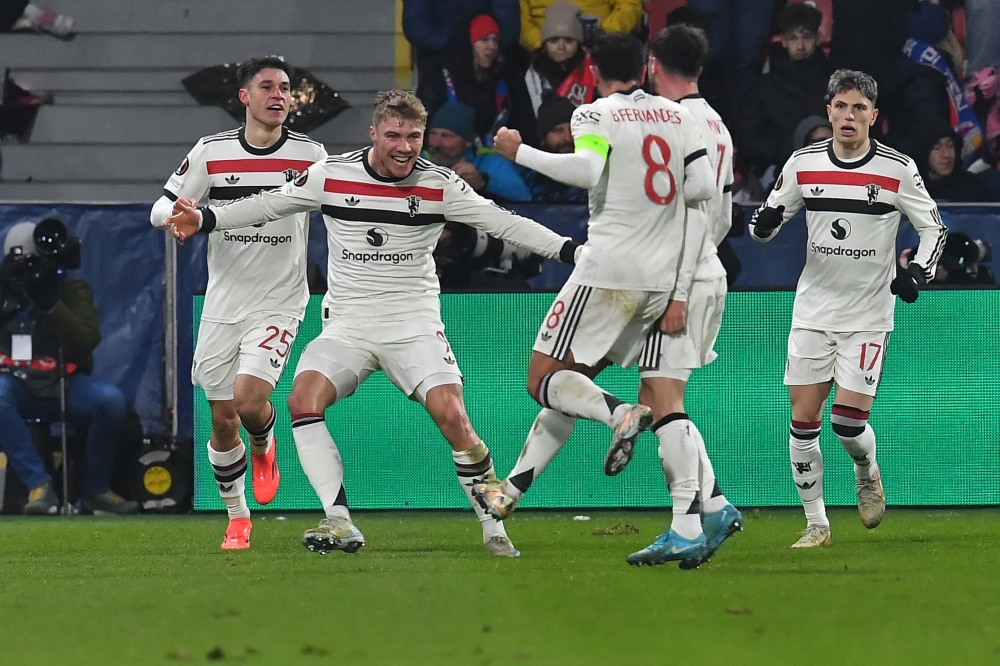 Manchester United players celebrate after Manchester United's Danish striker #09 Rasmus Hojlund (2nd left) scored a goal during the Uefa Europa League football match between Viktoria Plzen and Manchester United in Plzen, Czech Republic December 12, 2024. Manchester’s crisis-hit clubs face off in the Premier League when City host United on Sunday while Newcastle boss Eddie Howe badly needs a win against Leicester at St James’ Park. — AFP pic