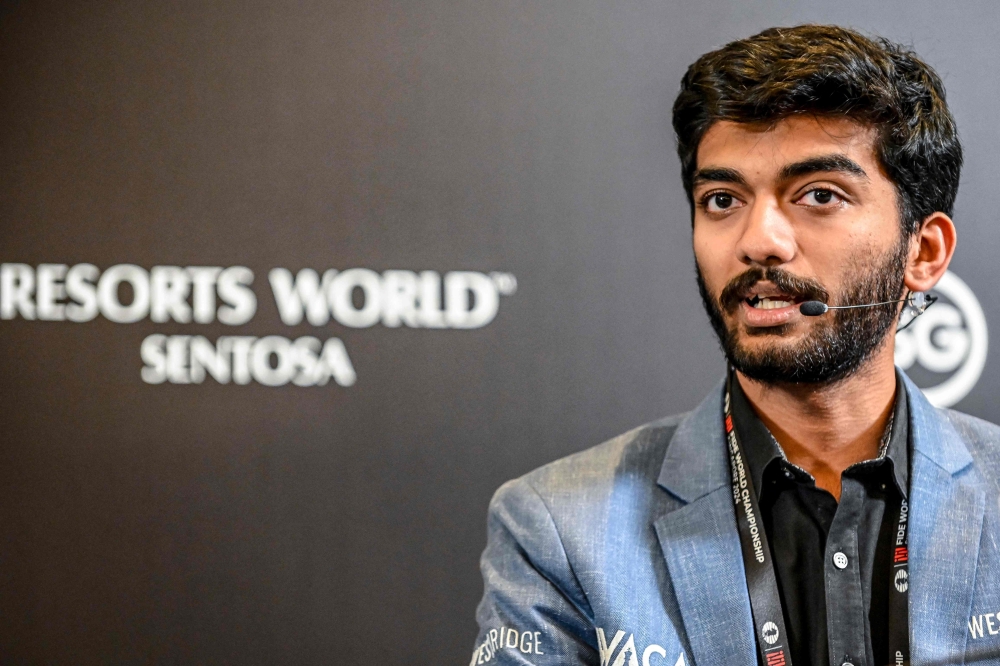 India’s grandmaster Gukesh Dommaraju speaks during a press conference after winning against China’s chess grandmaster Ding Liren in game 14 of the 2024 FIDE World Championship in Singapore on December 12, 2024. The 18-year-old became ‘the YOUNGEST WORLD CHAMPION in history’, said the International Chess Federation in a post on social media platform X, after Ding resigned in a thrilling endgame that had been expected to end in a draw. — AFP pic