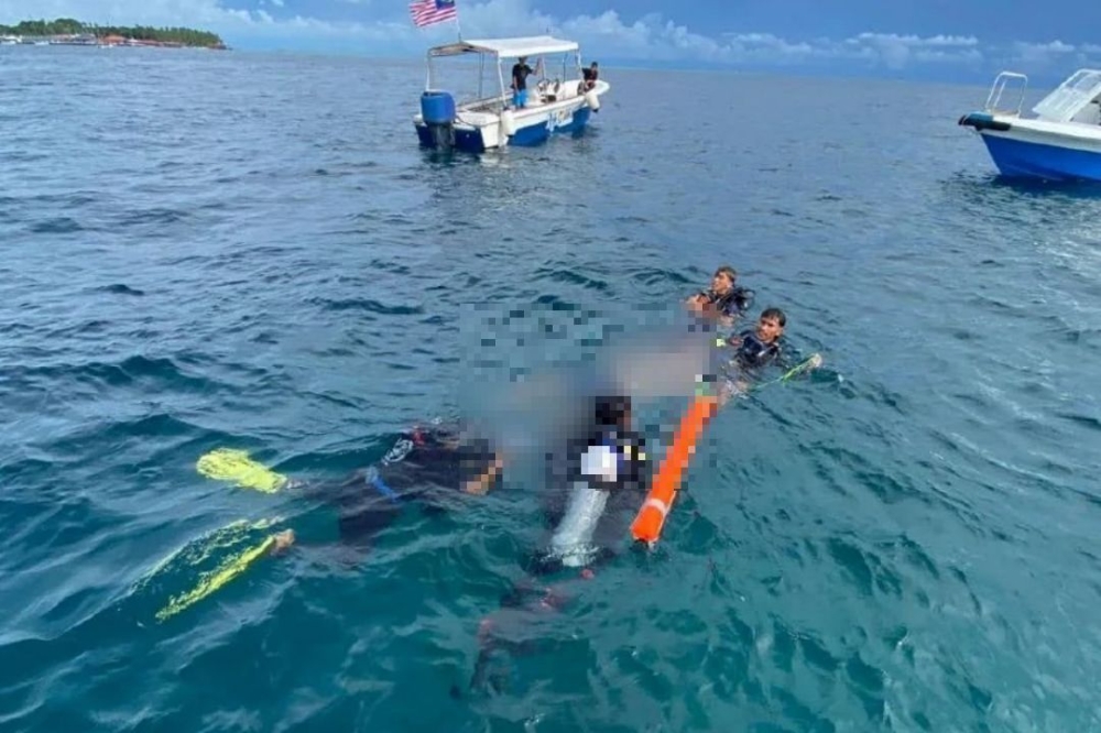 A body was found in a light-coloured T-shirt, shorts, shoes, and with a grey backpack. — Picture courtesy of Royal Malaysia Police