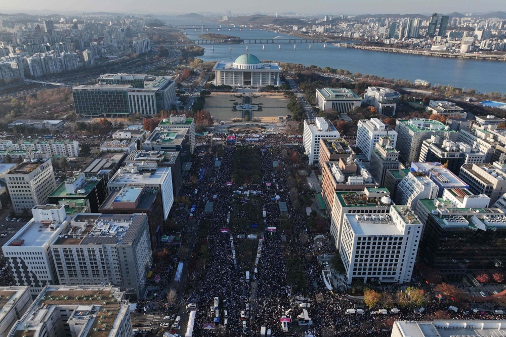 An aerial view of the protesters in Seoul calling for the ouster of South Korea President Yoon Suk Yeol who wait for the outcome of the second martial law impeachment vote as its Parliament vote on December 14, 2024. — AFP pic