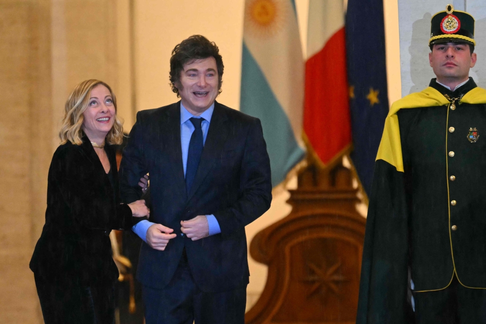 Italy’s Prime Minister Giorgia Meloni welcomes Argentina’s President Javier Milei at Palazzo Chigi prior their meeting in Rome December 13, 2024. The Italian government has granted citizenship to Argentine President Javier Milei, a source close to the matter told AFP today. — AFP pic