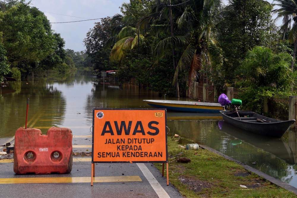 A file photograph shows floodwaters at Kampung Gual Tok Deh in Pasir Mas, Kelantan, on December 19, 2023. — Bernama pic