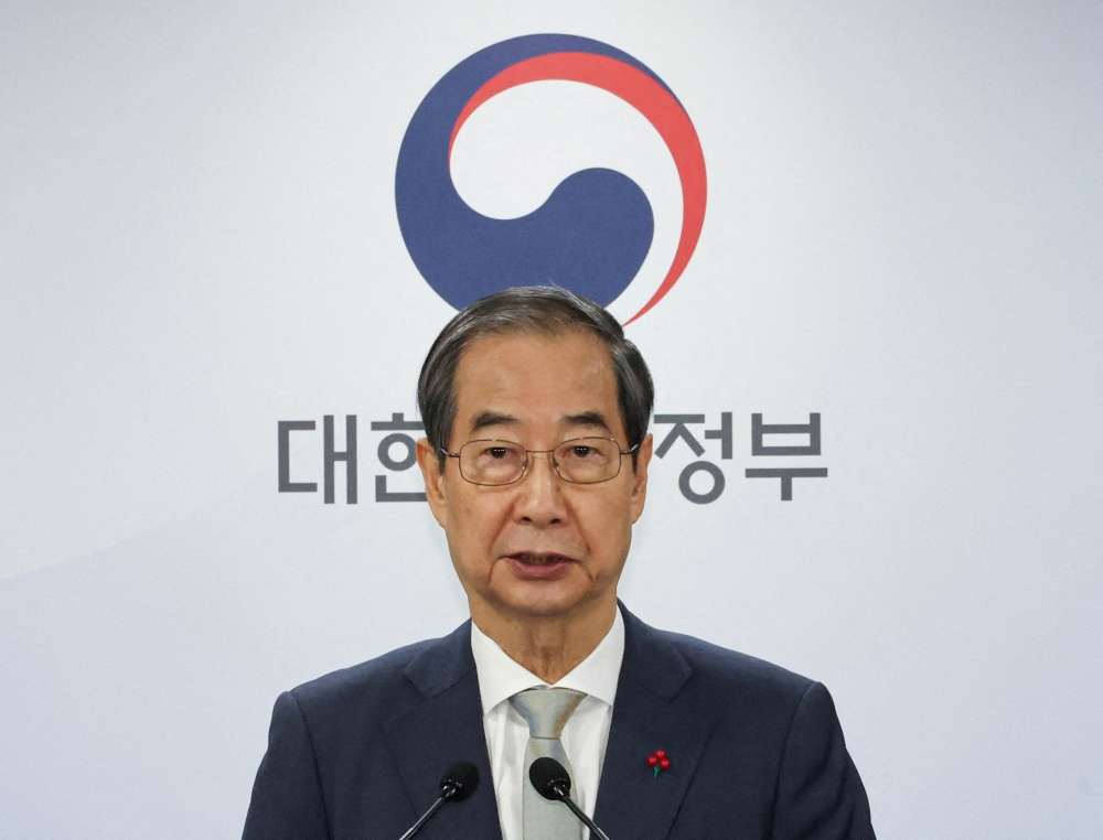 Prime Minister Han became South Korea’s acting president after yesterday’s impeachment of Yoon Suk-yeol. — Reuters pic