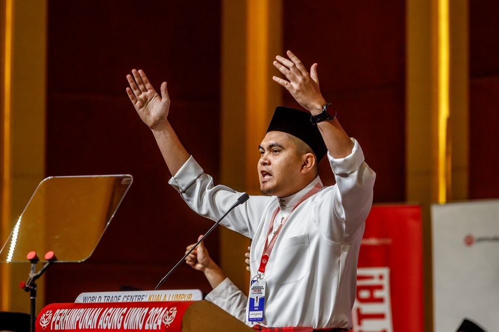 A file photograph shows Umno Youth chief Dr Muhamad Akmal Saleh speaking to his movement at the 2024 Umno General Assembly in Kuala Lumpur on August 22, 2024. — Picture by Firdaus Latif