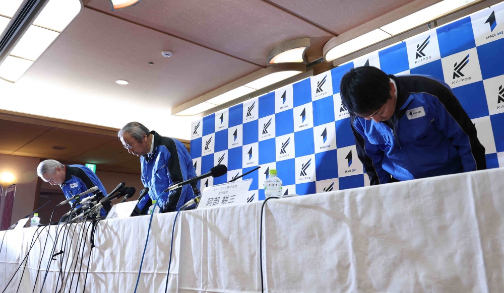 Japan’s Tokyo-based Space One President Masakazu Toyoda (centre) and others bow their heads during a press conference regarding the launch failure of their first small satellite rocket Kairos, in Nachikatsuura Town, Wakayama Prefecture March 13, 2024. — Jiji Press/AFP pic