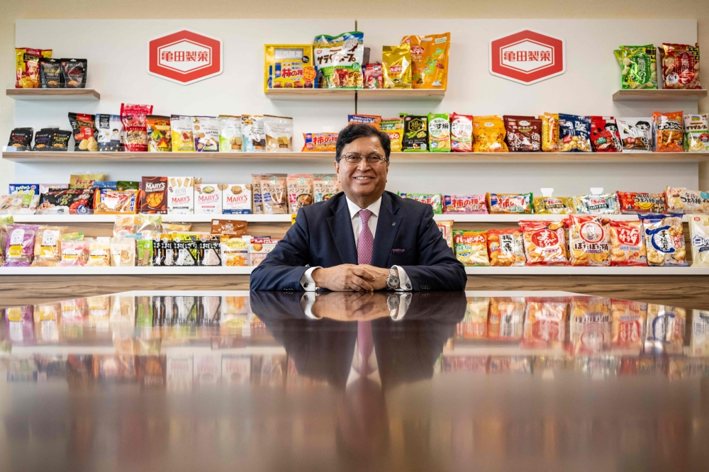 Lekh Juneja, chairman and CEO of Kameda Seika, posing for photos at the company’s headquarters in Niigata city, Niigata prefecture August 5, 2024. — AFP pic