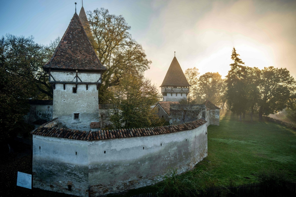 View of the fortified church in Cincsor, a small Transylvanian village some 250km north-west of Bucharest October 17, 2024. The medieval village of Cincsor is located in a region at the foot of the Carpathians where Germans settled in the 12th century, recruited by the Hungarian kings to colonise an uninhabited land. Before World War II, there were still up to 300,000 Germans, but there are only about 10,000 today, most of them having emigrated since the 1970s to flee persecution by the communist regime of Nicolae Ceausescu. — AFP pic