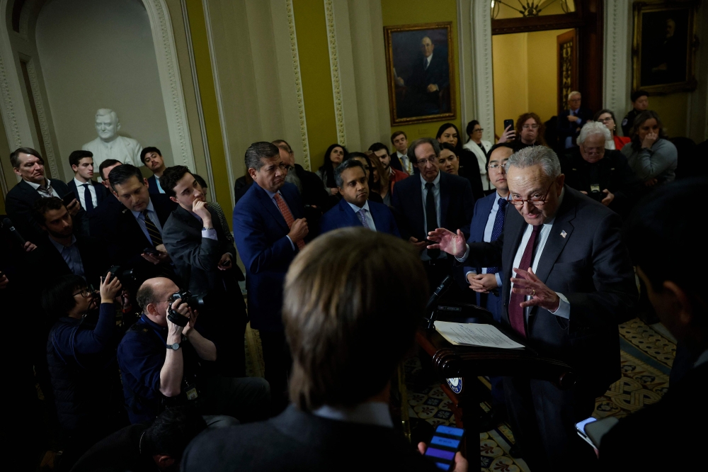 U.S. Senate Majority Leader Chuck Schumer speaks during a news conference following the weekly Senate Democratic policy luncheon at the U.S. Capitol on December 10, 2024 in Washington, DC. — AFP pic