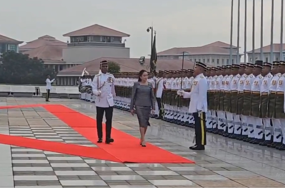 Thailand’s Prime Minister Paetongtarn Shinawatra inspects a guard of honour mounted by three officers and 102 members of the First Battalion of the Royal Ranger Regiment (Ceremonial). — Screengrab from X/Bernama 