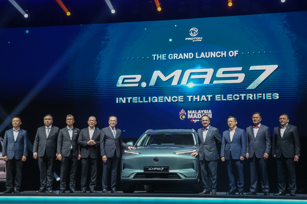 Prime Minister Datuk Seri Anwar Ibrahim (fifth left) poses for a group picture during the launch of the Proton e.MAS 7 at MITEC in Kuala Lumpur on December 16, 2024. — Picture by Yusof Mat Isa