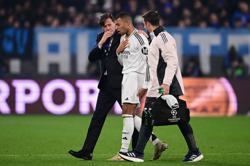 Real Madrid forward Kylian Mbappe has returned after a thigh injury and will travel to Doha for this week’s Intercontinental Cup final, the Spanish club said Monday. — AFP pic