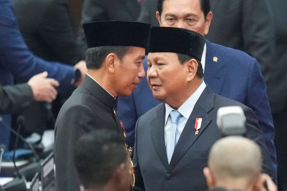 Former Indonesian president Joko Widodo is seen here with Indonesian President Prabowo Subianto. — Reuters pic
