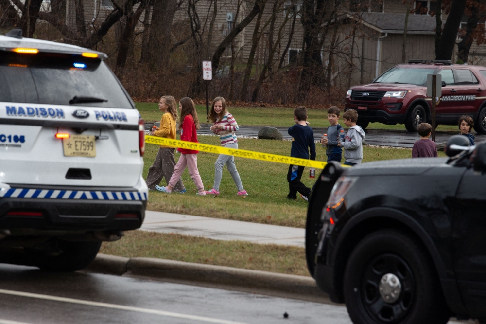 A 15-year-old girl opened fire in a Wisconsin school classroom on Monday, fatally shooting a fellow student and a teacher and wounding six other people before killing herself with the handgun, police said. — Reuters pic