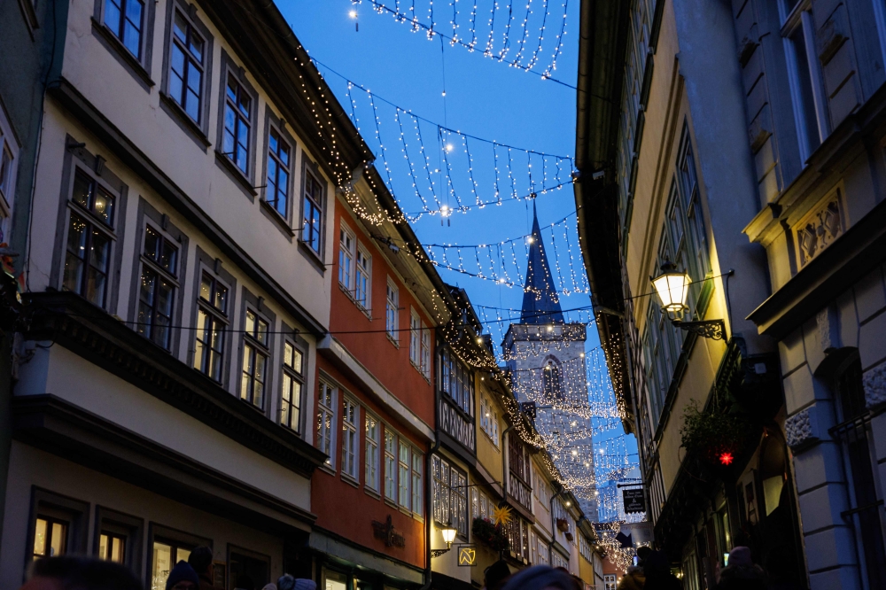 Christmas decorations are seen attached between houses on the Kraemerbruecke bridge in the old town of Erfurt, eastern Germany on December 13, 2024. A white Christmas may increasingly become a nostalgic memory as the Northern Hemisphere sees ever fewer snowy winter days due to climate change, with Europe warming quickest, a report warned on Tuesday. — AFP pic 