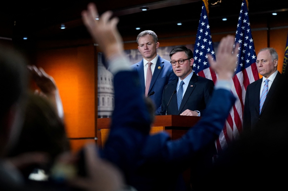US House Speaker Mike Johnson (R-LA) speaks to reporters following a House Republican conference meeting on Capitol Hill in Washington, on December 17, 2024. — Reuters pic