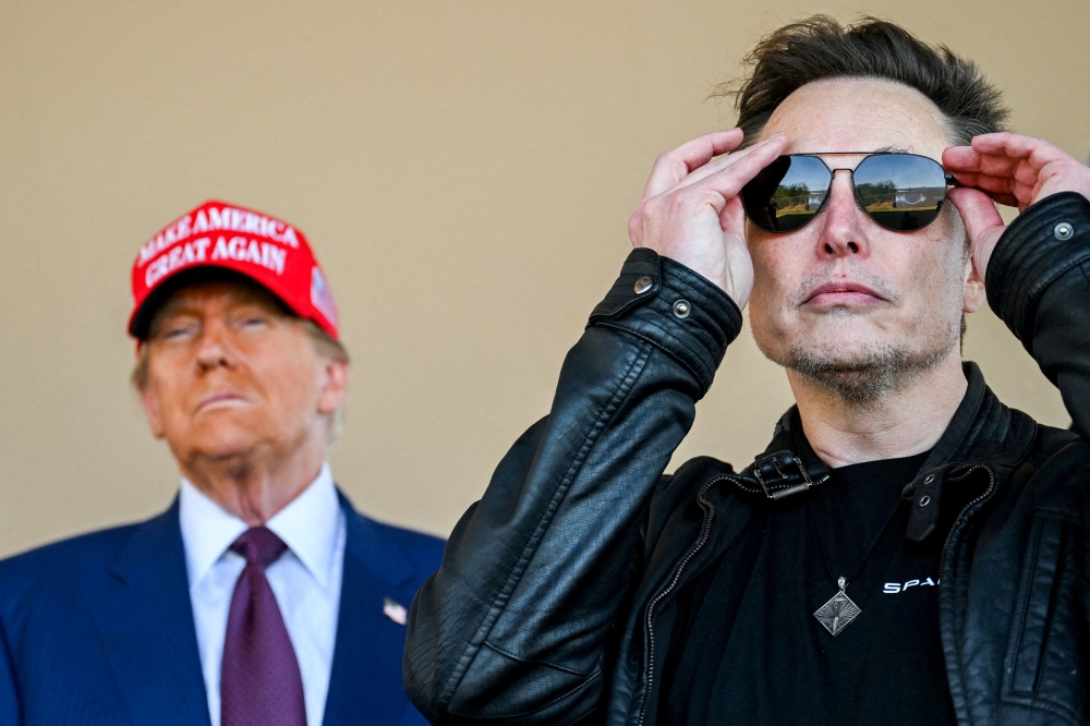 US President-elect Donald Trump and Elon Musk watch the launch of the sixth test flight of the SpaceX Starship rocket in Brownsville, Texas, on November 19, 2024. — Reuters pic