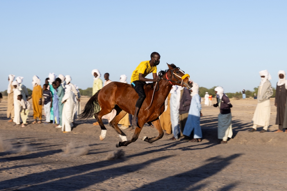 A jockey takes part in the selection trials two days before the start of the first horse race of the season at the Biligoni racecourse in Chad on November 28, 2024. — AFP pic 