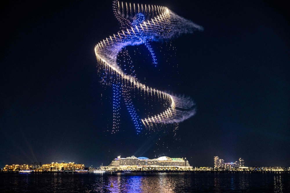 Flying drones depict a dancer in the sky during a show above Bluewaters Island near Dubai Marina in Dubai late on December 13, 2024. — AFP pic