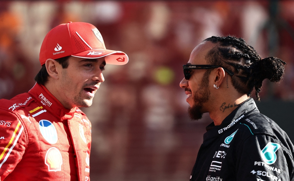 Ferrari’s Charles Leclerc with Mercedes’ Lewis Hamilton during the drivers parade before the race at the Abu Dhabi Grand Prix, Yas Marina Circuit, Abu Dhabi, December 8, 2024. — Reuters pic 