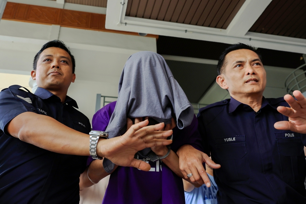 Comedian and actor Muhammad Nizamuddin Ahmad is brought to the Sepang Sessions Court on Dec 20, 2024. — Bernama pic