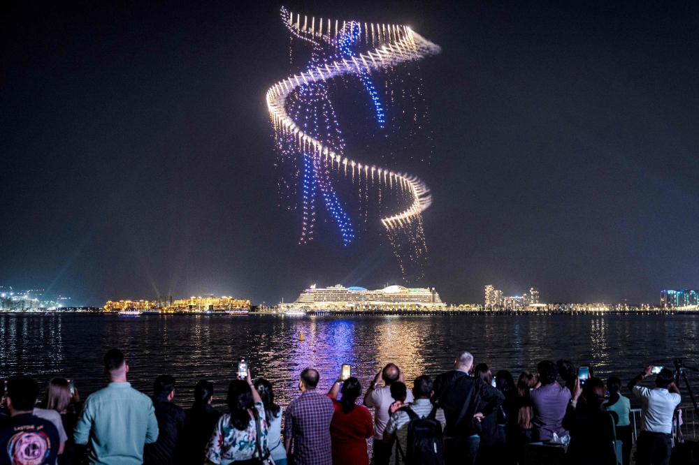 File photo of people watching a drone show in Bluewaters Island near Dubai Marina in Dubai. — AFP