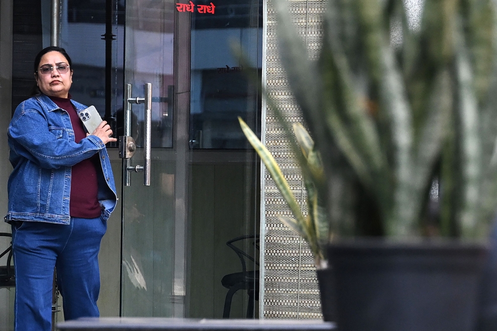 In this photograph taken on December 10, 2024, Bhavna Paliwal, founder of Tejas Detective Agency, leaves her office in New Delhi. — AFP pic
