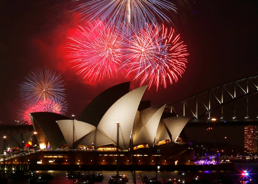 Fireworks light up the Sydney Opera House and Harbour Bridge during an early light show before the midnight New Year fireworks, December 31, 2014. — Reuters pic