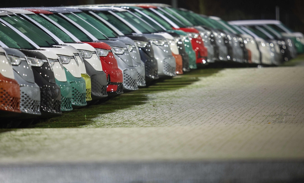 New VW ID Buzz vehicles, fully electric-driven microbus from Volkswagen Commercial Vehicles, are seen parked next to the commercial vehicle plant of German car manufacturer Volkswagen (VW) in Hanover, northern Germany, before delivery on 19 December 2024. — AFP pic