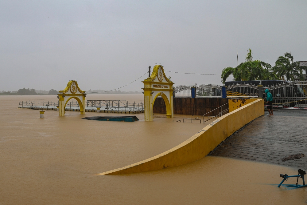 A file photograph shows the Sungai Kelantan flooding the Tambatan D’Raja near Kota Baru on Nov 29, 2024. — Bernama pic