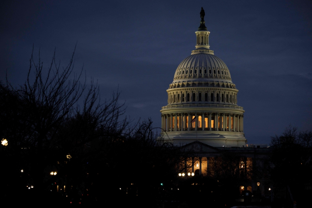 US lawmakers sat at the Capitol in Washington DC and voted across party-lines to approve a Bill to continue funds to agencies until mid-March 2025 to prevent a government shutdown. — AFP pic
