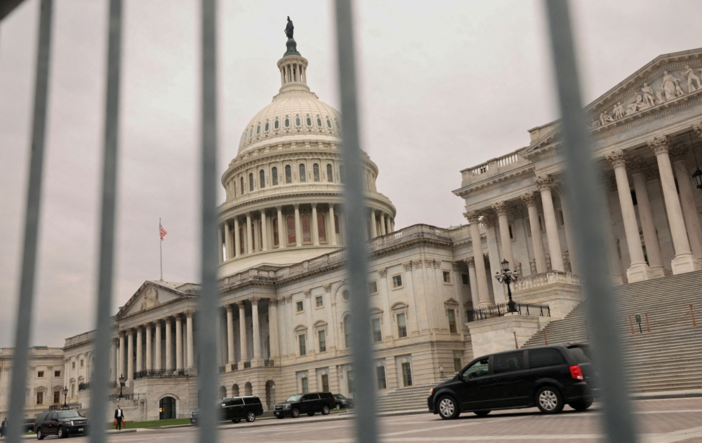 The dome of the Capitol is seen through a security fence in Washington, U.S., December 20, 2024. — Reuters pic
