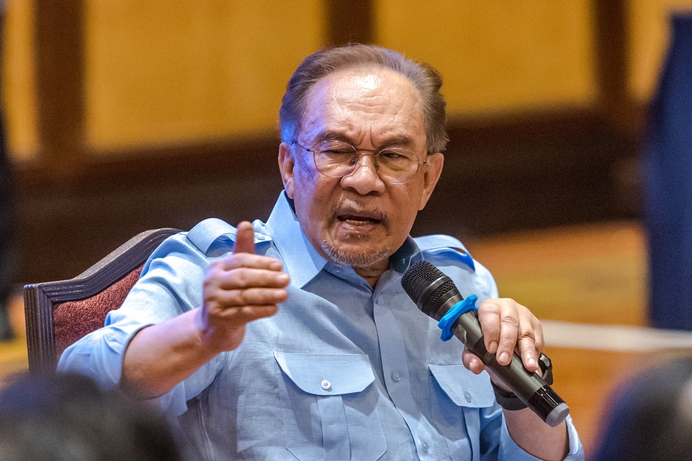 Prime Minister Datuk Seri Anwar Ibrahim speaks during a press conference in Subang December 21, 2024. — Picture by Firdaus Latif