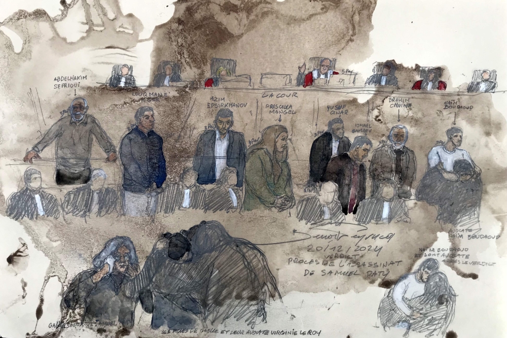 A French court on Friday handed heavy sentences to several men convicted of having played a role in the jihadist beheading of schoolteacher Samuel Paty in 2020. — AFP pic 