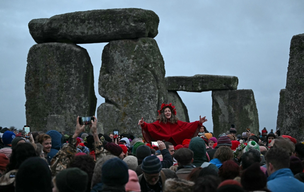 Revellers celebrate the pagan festival of 'Winter Solstice' at Stonehenge in Wiltshire in southern England on December 21, 2024 — AFP pic