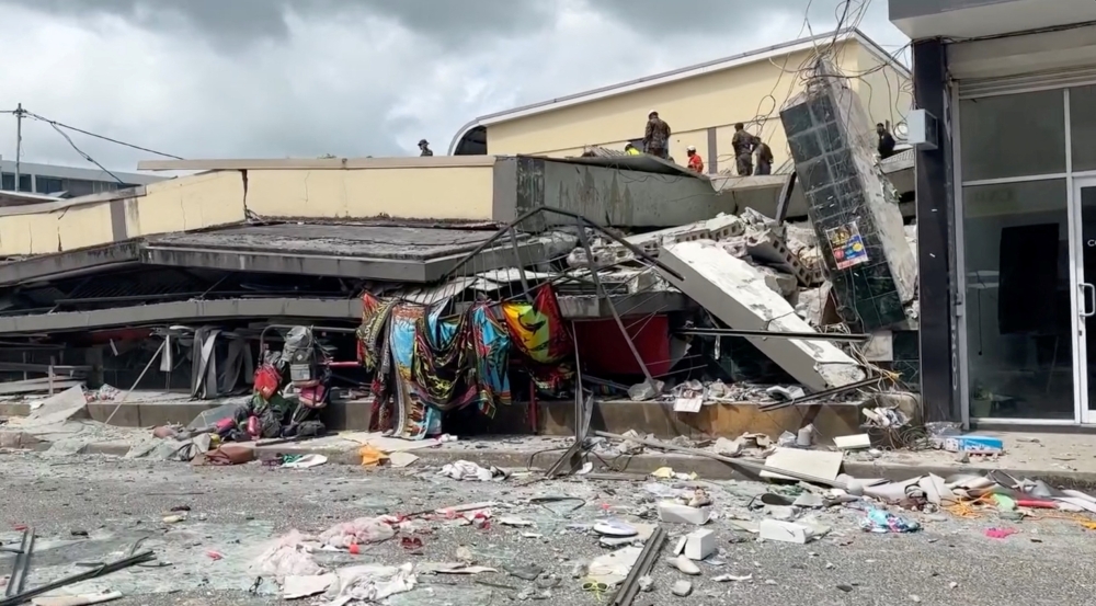 Rubble lies around a collapsed building following a strong earthquake in Port Vila, Vanuatu on Dec 17. — Reuters