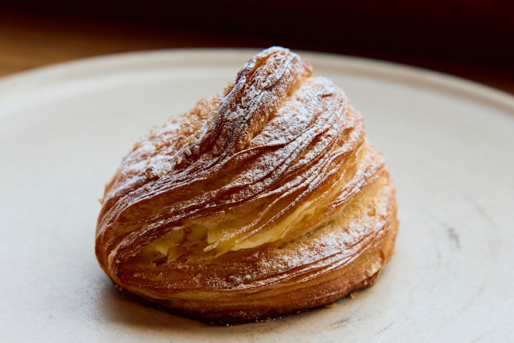 A croissant dough mince pie is pictured at Pophams bakery in London on December 20, 2024. — AFP pic