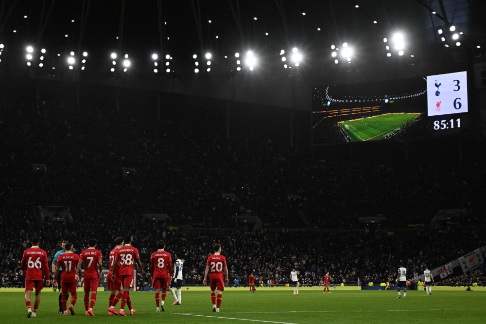 Liverpool's players walk back to restart as the scoreboard shows the 3-6 scoreline during the English Premier League football match between Tottenham Hotspur and Liverpool at the Tottenham Hotspur Stadium in London, on December 22, 2024. — AFP pic