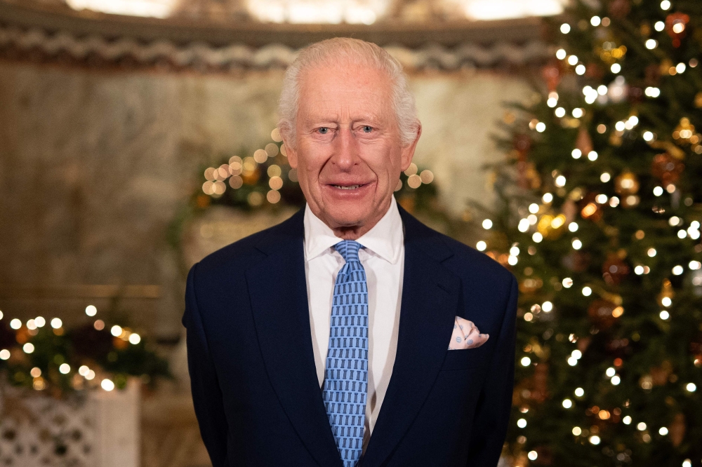Britain's King Charles III smiles during the recording of his Christmas message at the Fitzrovia Chapel in central London on December 11, 2024. — AFP pic