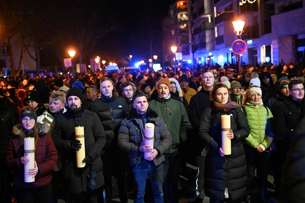 People attend a commemoration organised by the far-right Alternative for Germany (AfD) party at the cathedral square. — AFP