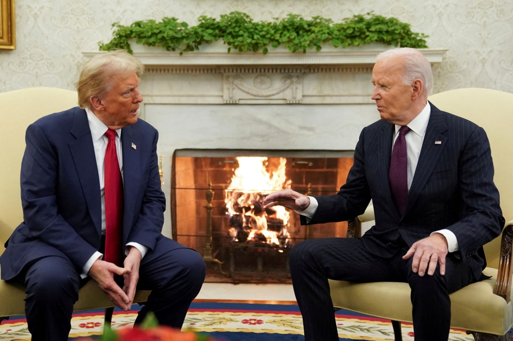 US President Joe Biden meets with President-elect Donald Trump in the Oval Office at the White House in Washington November 13, 2024. — Reuters pic  