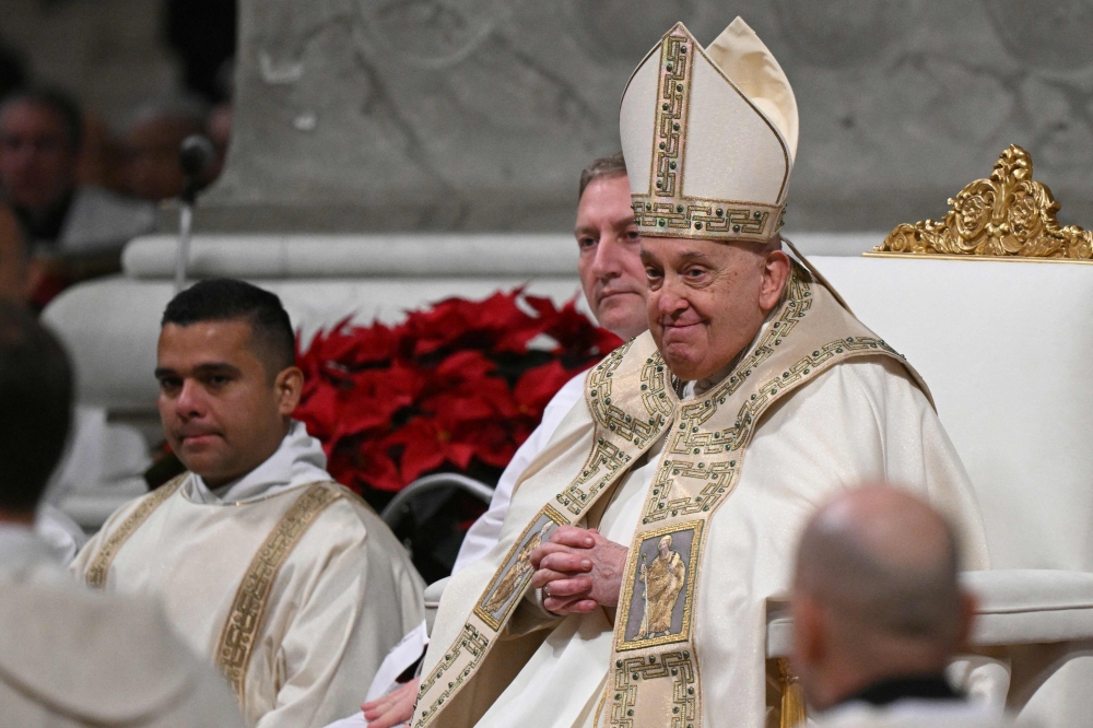 Pope Francis presides over the Christmas Eve mass at St Peter's Basilica in the Vatican on December 24, 2024. Pope Francis marks Christmas Eve with a special ceremony launching Jubilee 2025, a year of Catholic celebrations set to draw more than 30 million pilgrims to Rome. — AFP pic